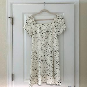 Off white with polka black dots dress open tie back slightly off shoulders.